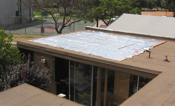 Large custom 22' x 24' CoolTarp temporarily installed over an office space for tests